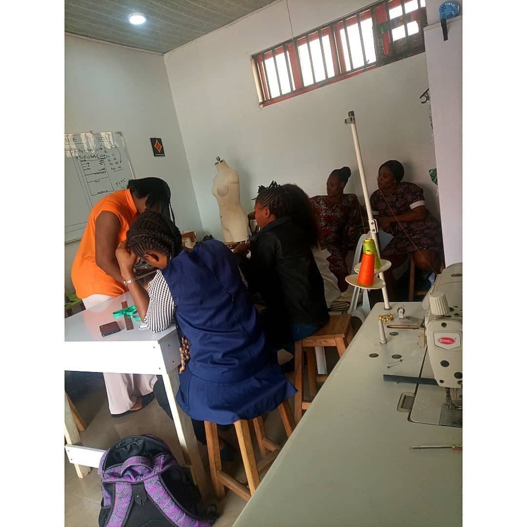 Students drafting patterns at a long table