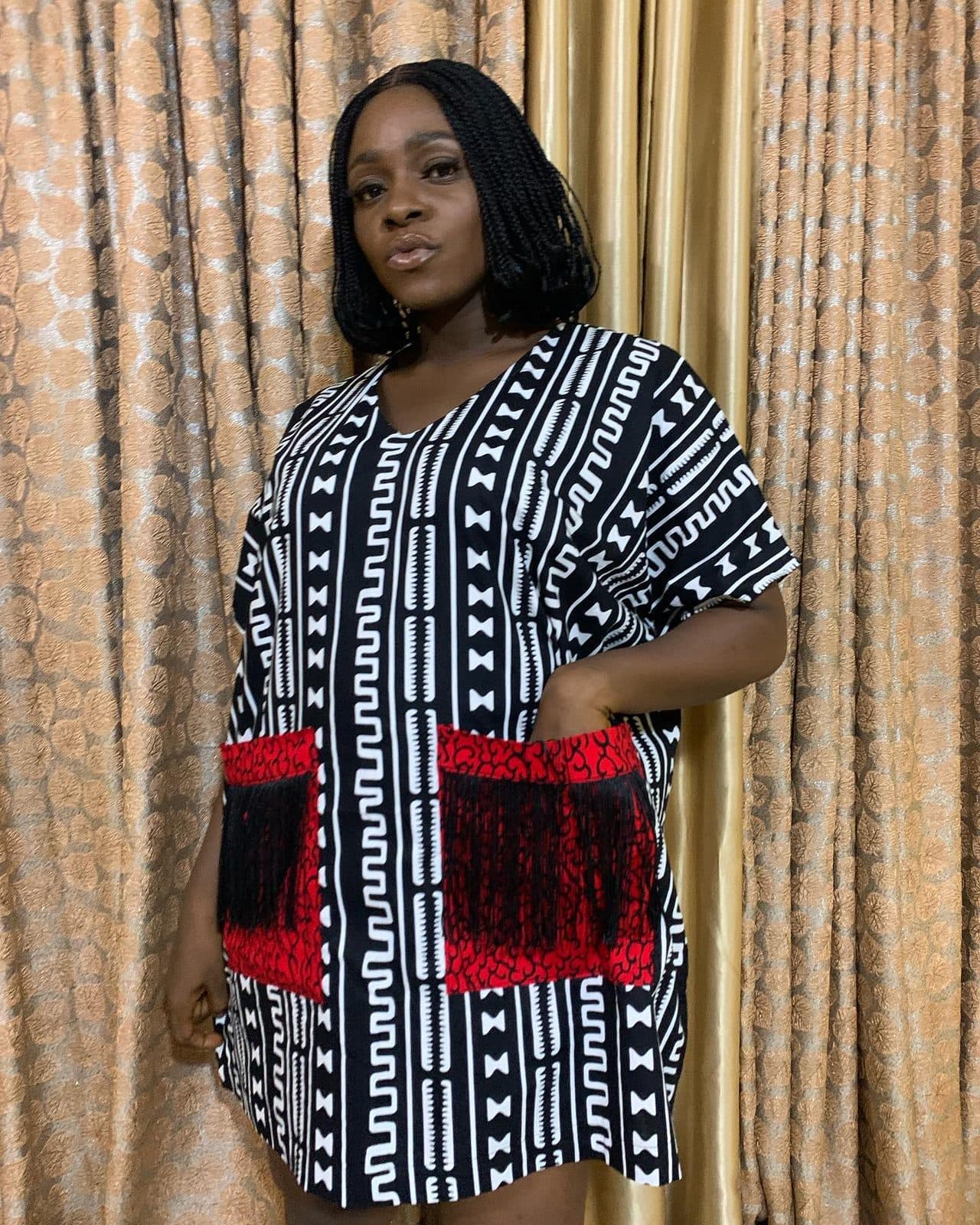 A woman in the TIDO Ankara dress