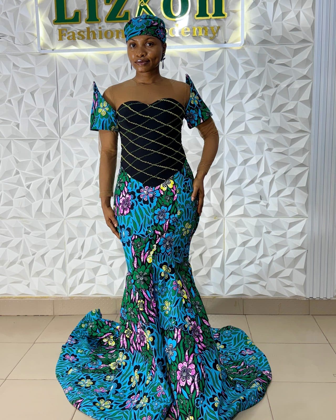 A student in an Ankara mermaid gown with a bustier