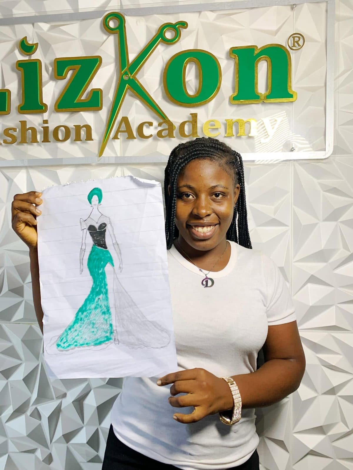 A student holding her fashion illustration