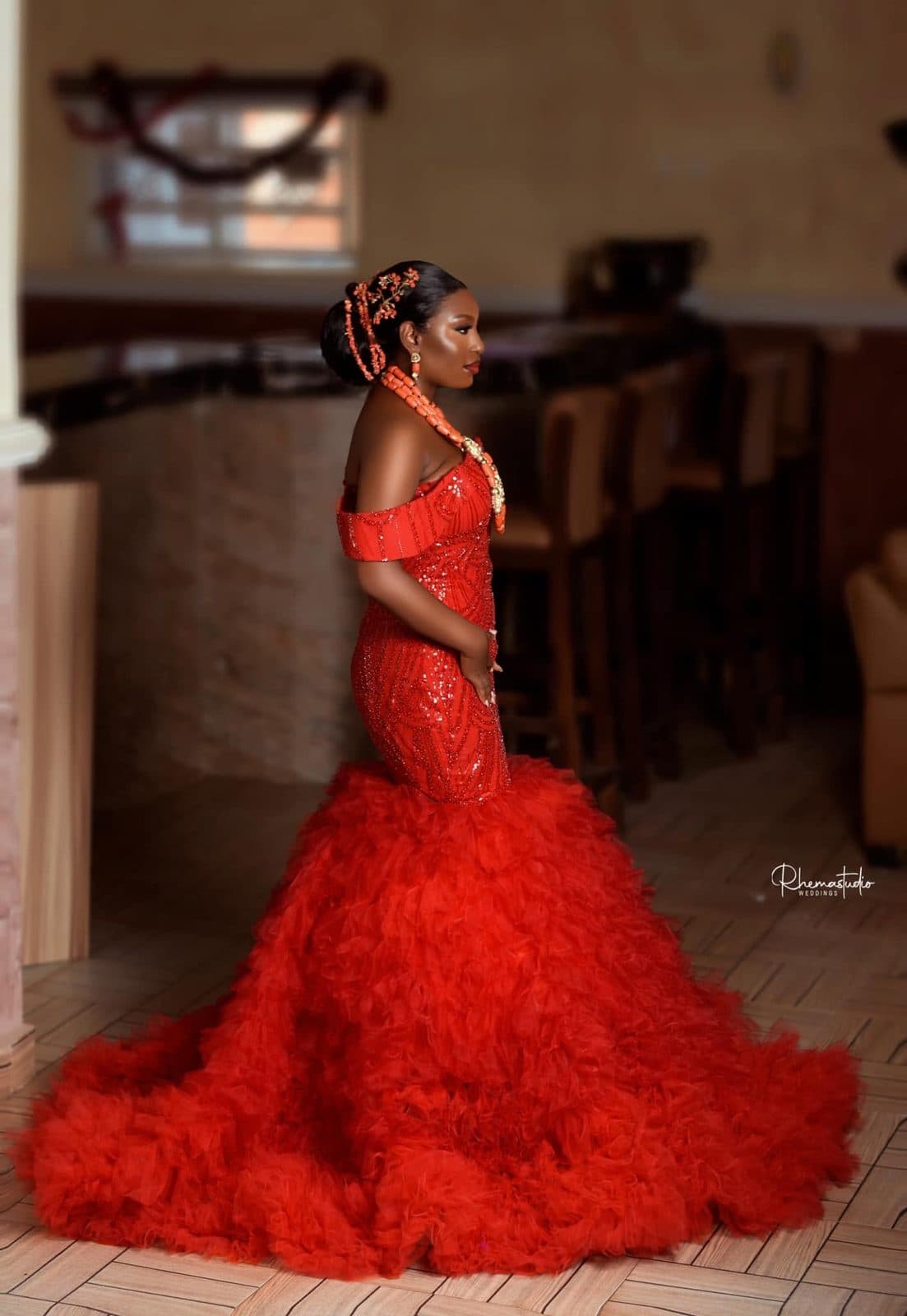 Full-length view of the red tulle gown and train