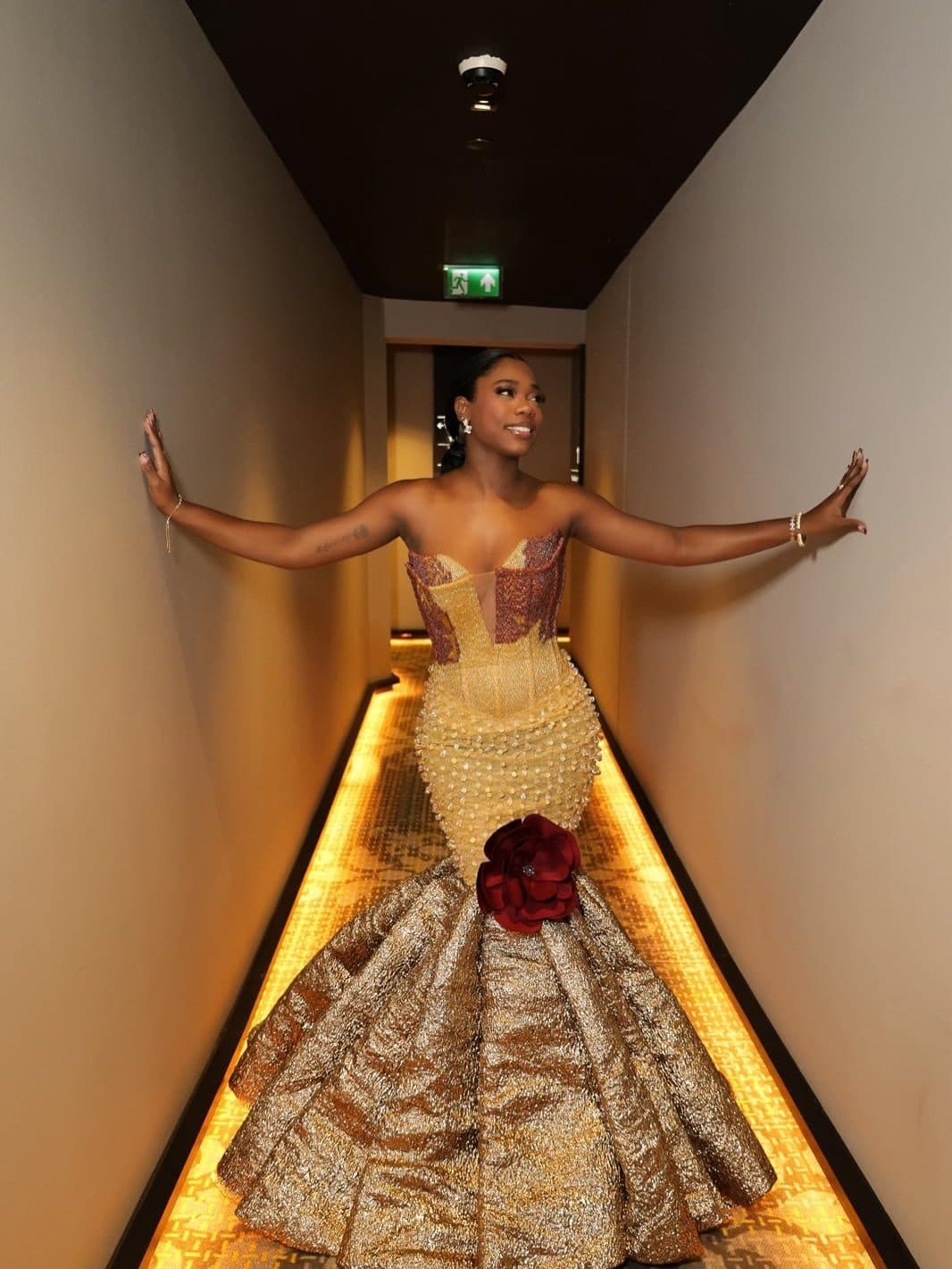 The client posing in the corridor