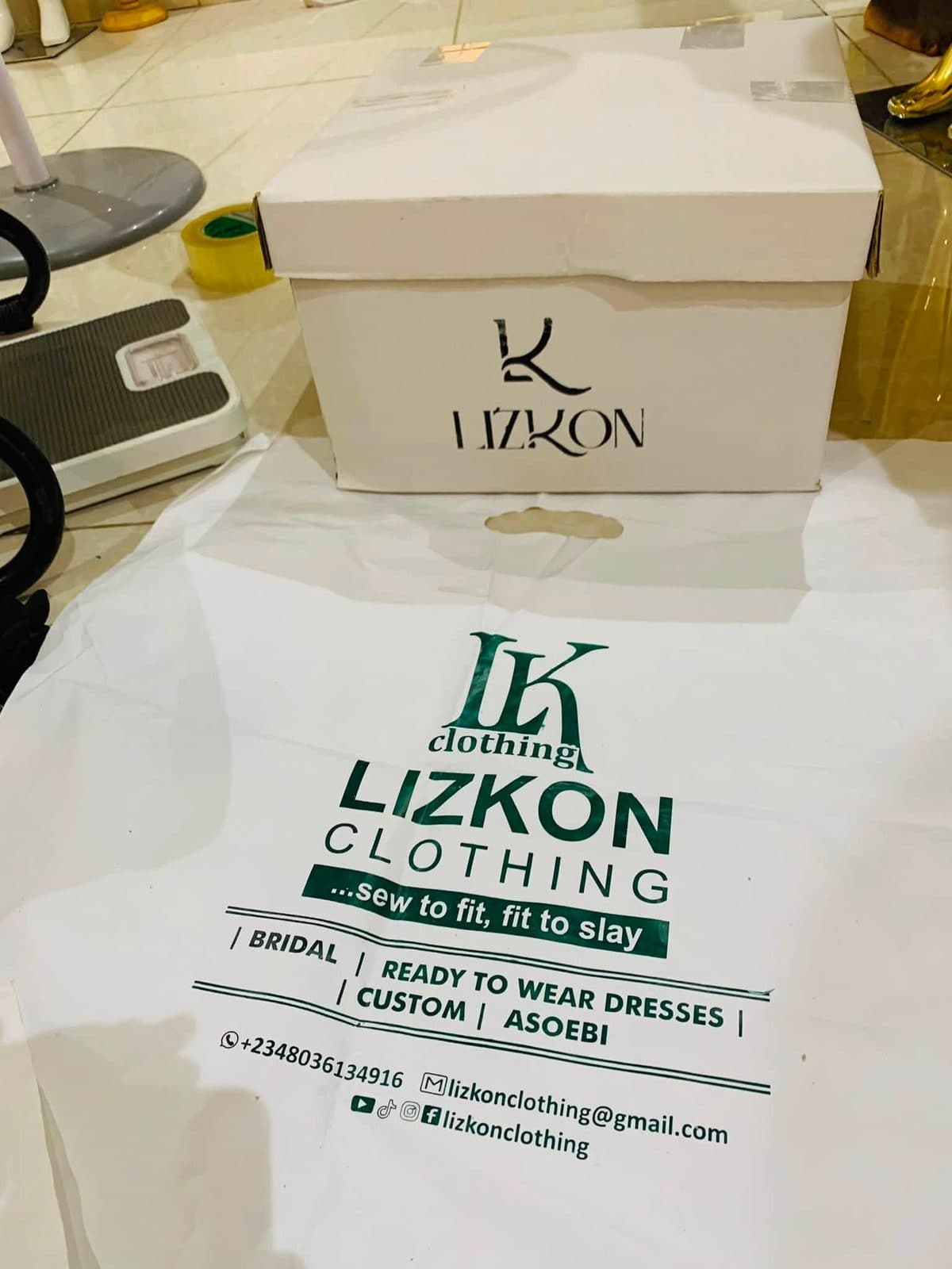 A Lizkon branded box with a shipping label