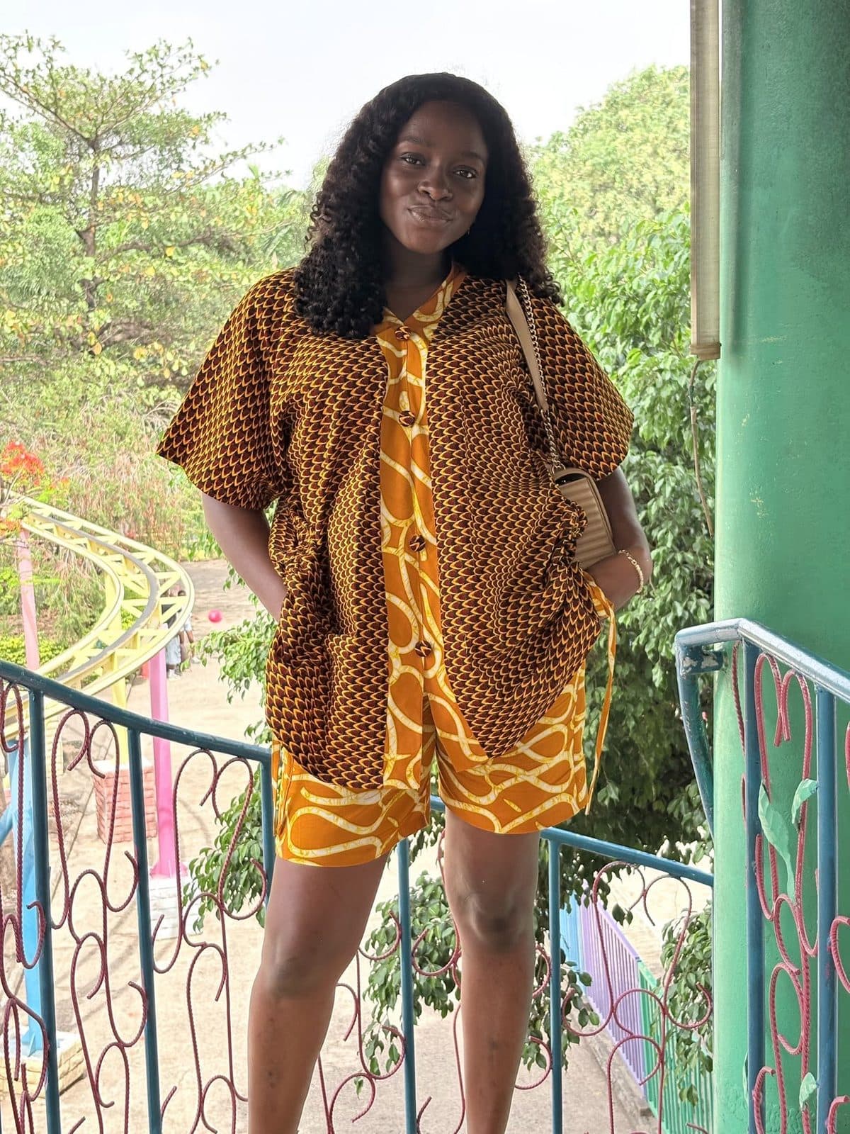 A woman in a Lizkon Ankara shirt and shorts set