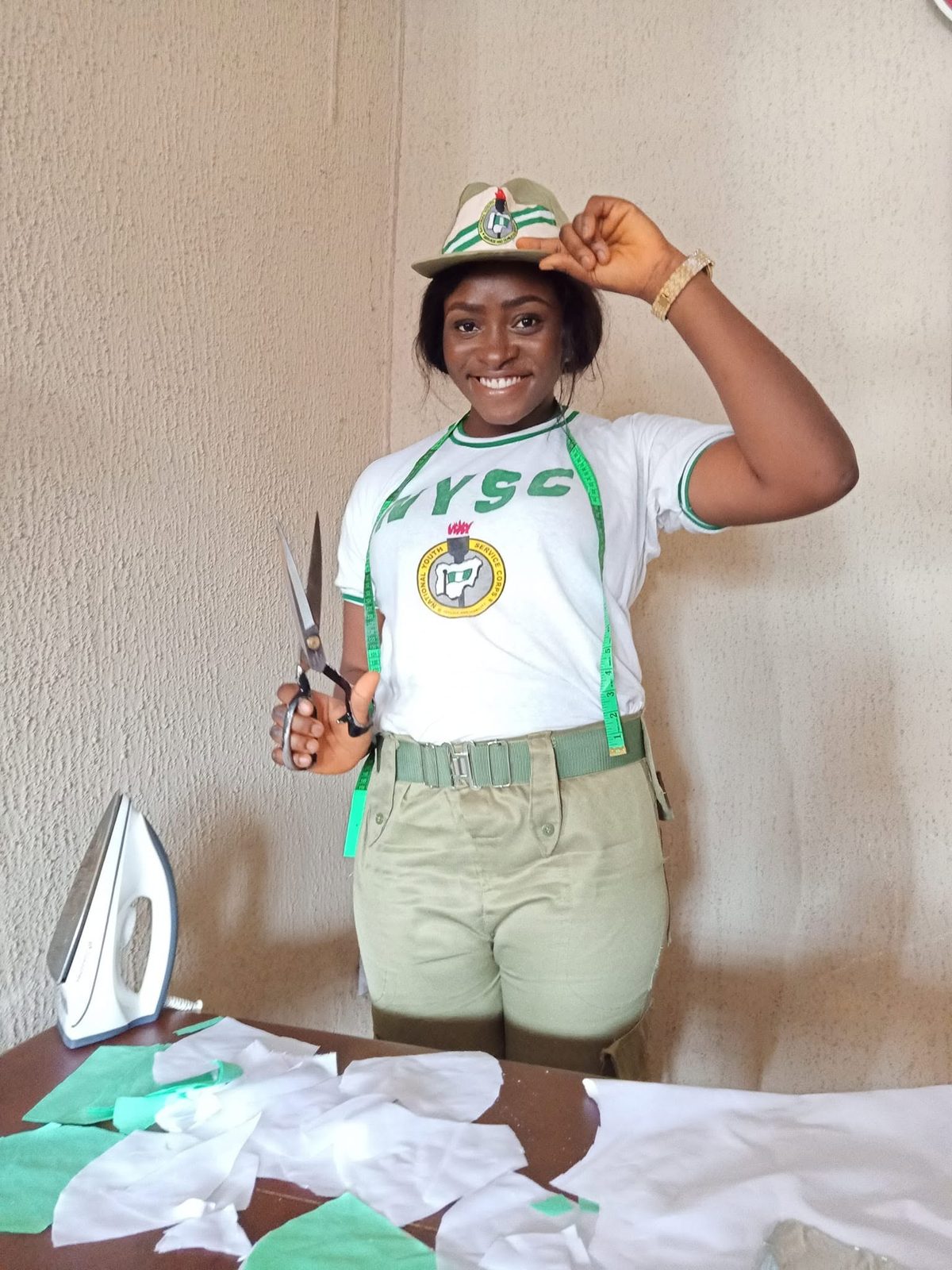Elizabeth in her NYSC uniform in the studio, 2020